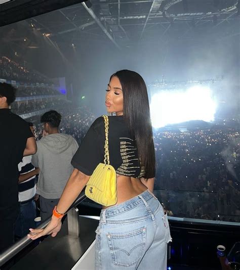 Instagram Influencer Mya Mills Posing For Insta Photo At A Concert In The Audience Crowd Wearing