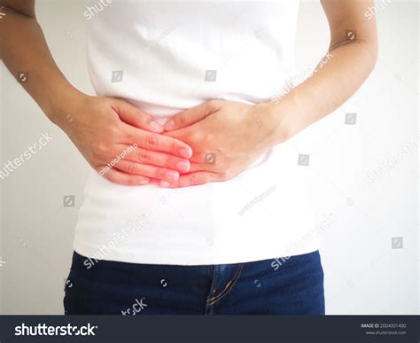 woman suffering abdominal pain  side stock photo