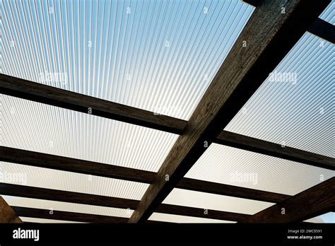 Wooden Canopy Roof Structure Made Of Colored Polycarbonate Stock Photo