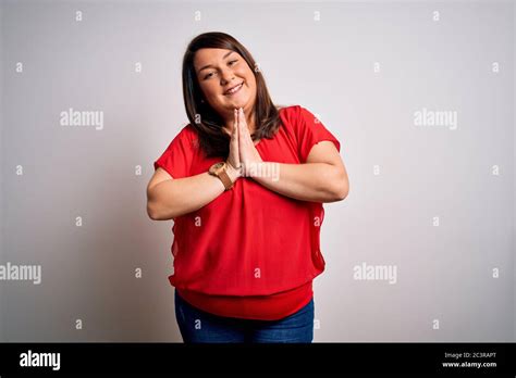 Beautiful Brunette Plus Size Woman Wearing Casual Red T Shirt Over Isolated White Background