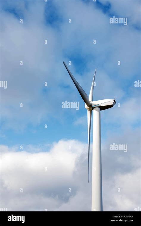 Isolated Silhouette Of Windturbine Energy Generator On Blue And Cloudy