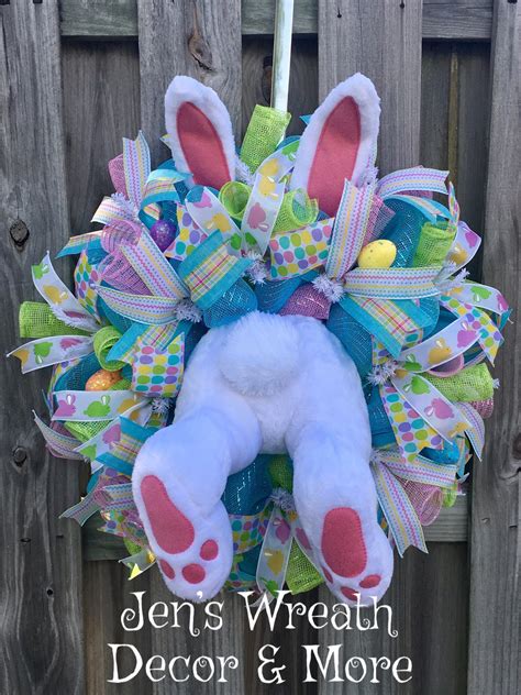 A Stuffed Animal Hanging On The Side Of A Wooden Fence With Easter