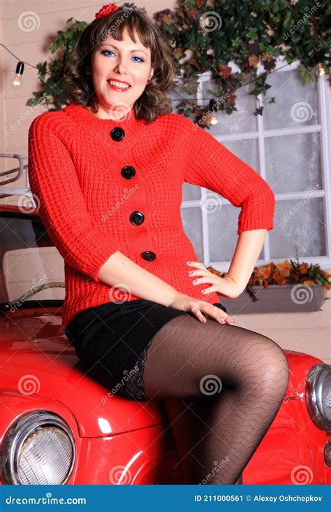 Brunette Legged Photomodel In Black Minidress And Stockings Posing In Studio Stock Image Image