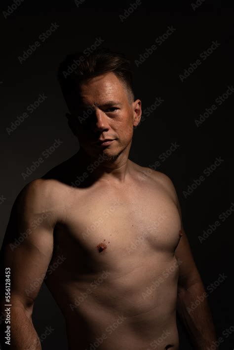 Sexy Portrait Of Muscular Handsome Topless Male Isolated Against A