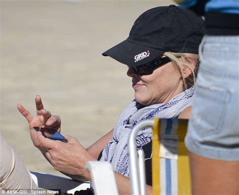 Sharon Stone Covers Bikini Body As Shirtless Toyboy Shines Although Cheeky Red Bra Strap Is On