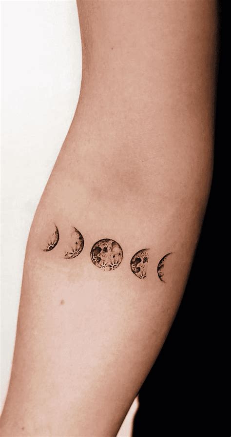 A Woman S Arm With Three Phases Of The Moon Tattoo