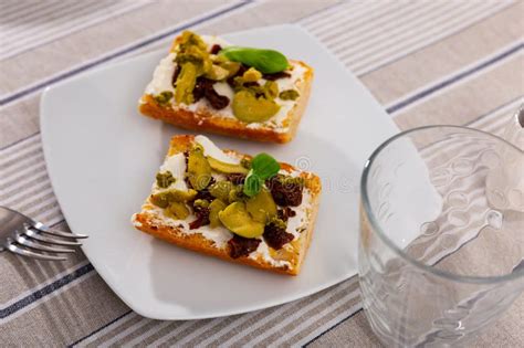 Toasted Sandwiches With Cream Cheese Sun Dried Tomatoes And Olives