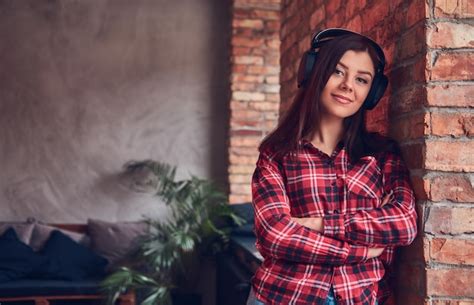 Premium Photo Portrait Of A Charming Brunette In A Flannel Shirt And Jeans Lis