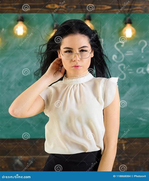 Woman With Long Hair In White Blouse Stands In Classroom Lady Strict