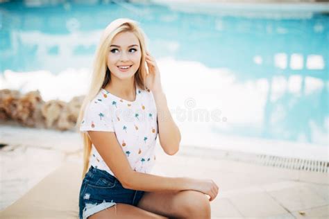 Beauty Blonde Woman Enjoying Vacation Holidays At Hotel Resort With Swimming Pool Near The Beach