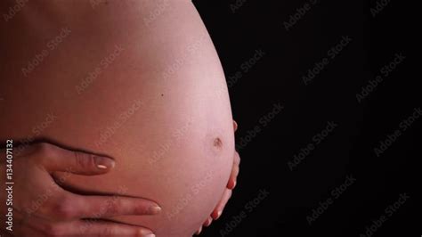 Pregnant Woman Touching Caressing Her Naked Big Belly Closeup On Black Background Pregnancy