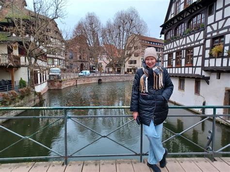 Full Length Mature Woman At The Amazing Traditional Colorful Houses In La Petite France