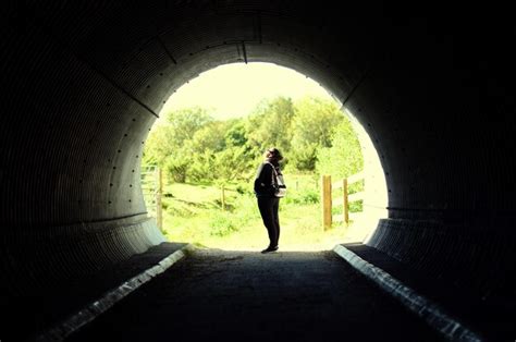 premium photo side view  woman standing  tunnel
