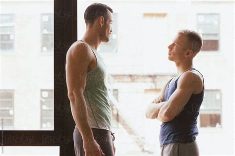 Gay Male Jock Couple Having Confrontation By Window Del Colaborador De Stocksy Joselito