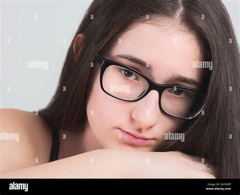 Portrait Of A Serious Bespectacled Long Haired Brunette Teen Girl Stock Photo Alamy