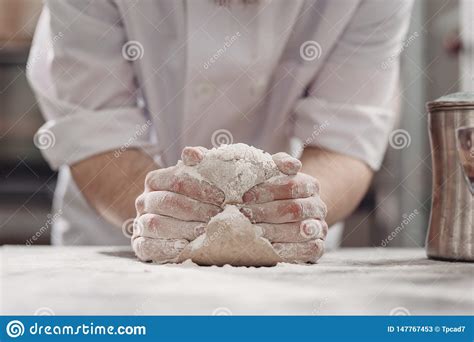 Baker Kneads Dough On The Table In The Bakery Stock Image Image Of Adult Flour 147767453