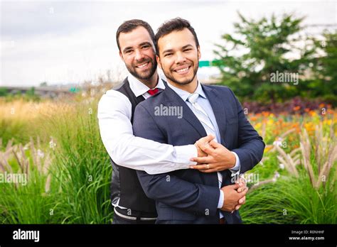 Handsome Gay Male Couple In The Park On Their Wedding Day Stock Photo Alamy