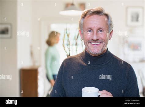 Portrait Smiling Confident Mature Man Drinking Tea Stock Photo Alamy