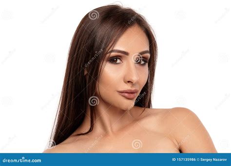 Close Up Portrait Of A Brunette Nude Model Girl With Professional Evening Make Up And Plump Lips