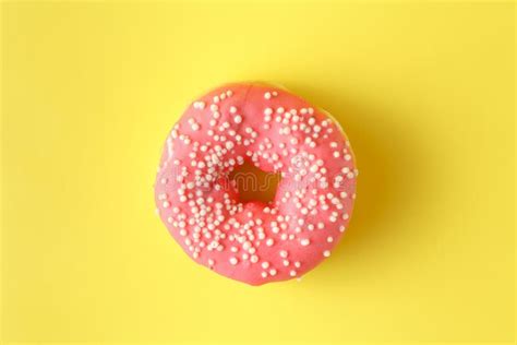 Donuts with Icing on Pastel Yellow Background. Sweet Donuts. Stock ...