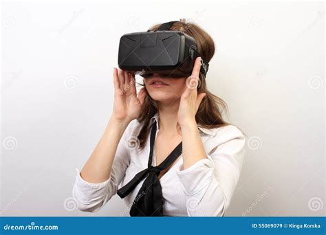 Intrigued Woman In A White Formal Shirt Wearing Oculus Rift Vr Virtual