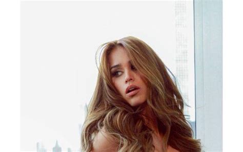 In Suggestive Poses Yanet Garc A Exhibits Her Shapely Curves With Red Fishnet Lingerie