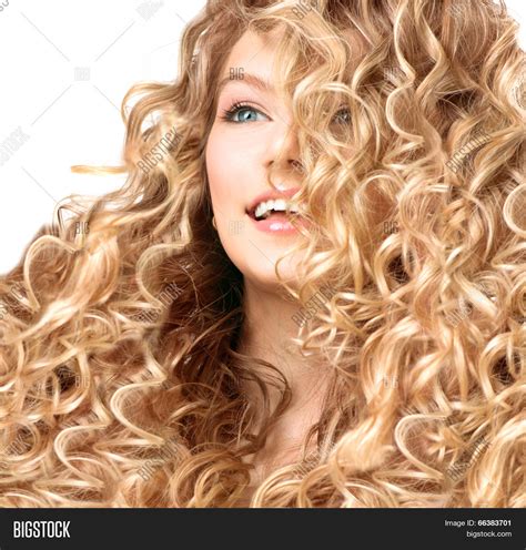 Beauty Girl With Blonde Curly Hair Healthy And Long Permed Blond Wavy Hair Beautiful Smiling