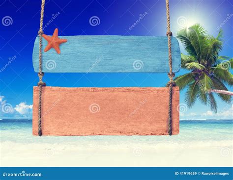 Colorful Wooden Signpost Hanging On A Tropical Beach Stock Image