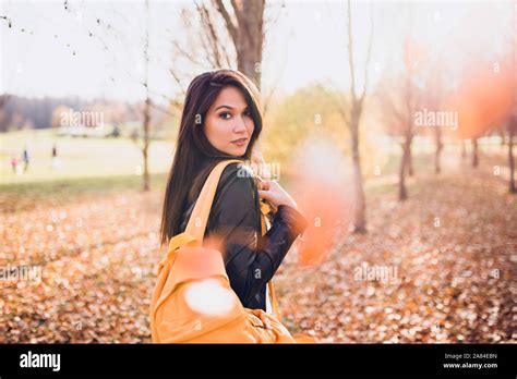 Charming Brunette Girl Turns Around Looking Big Eyes Stock Photo Alamy