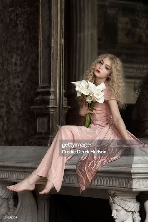 Portrait Of French Actress Anamaria Vartolomei Sits Atop A Fireplace