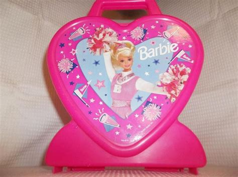 A Pink Heart Shaped Toy Case With Barbie On It S Back And The Words Barbie