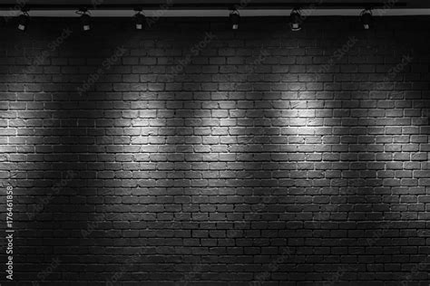 Black Brick Wall Background With Light Bulb Stock Photo Adobe Stock