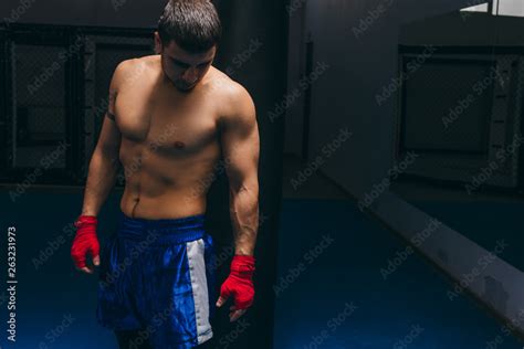 Portrait Of Kickbox Professional Fighter With Naked Muscular Torso Posing For A Camera