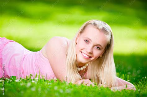 Beautiful Blonde Lying On The Grass Stock Photo Adobe Stock