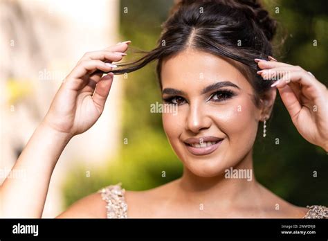 Close Up Portrait Of A Teen Brunette Girl In A Golden Dress Ready For Prom Stock Photo Alamy