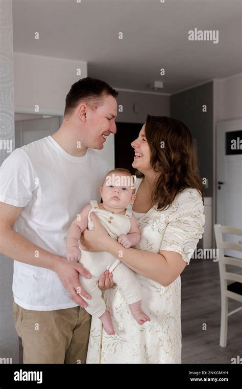 parents carrying baby boy  home stock photo alamy