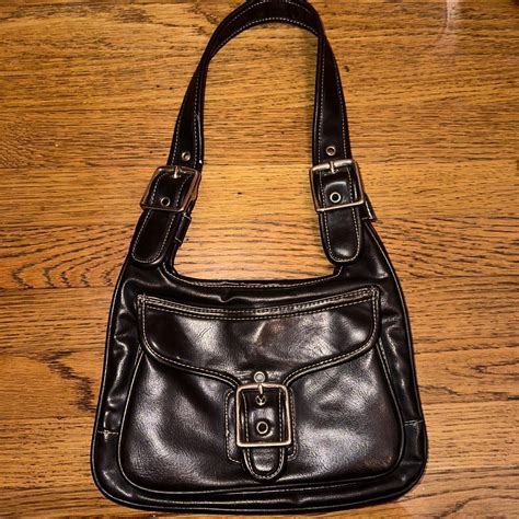 another super cute brown purse with fun hardware... - Depop