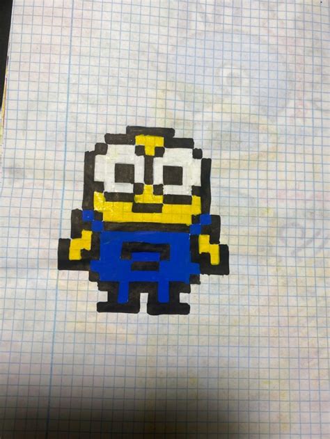 An Image Of A Pixel Art Piece With A Minion In The Middle On A Sheet Of