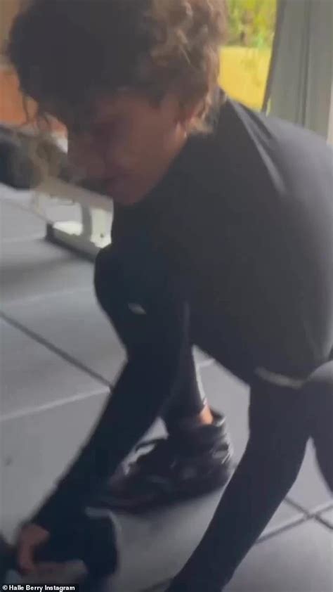 Halle Berry Teases Her Cleavage In A Black String Bikini As She Poses Oceanside With A