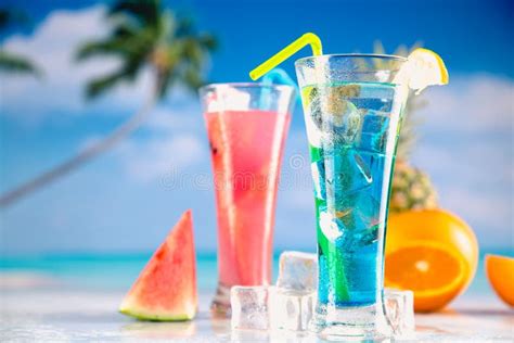 Set of Exotic Drinks on the Beach with Blue Ocean Background Stock ...