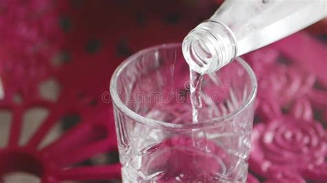 Pouring Hot Water From A Thermos Into Chinese Tea Ware In A Garden With Soft Morning Light