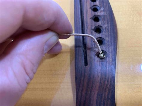 how to restring a guitar 7