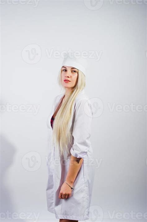 Attractive Blonde Female Doctor Or Nurse In Lab Coat Isolated On White Background 10568905