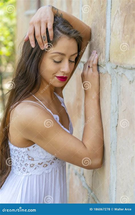 A Lovely Brunette Model Enjoys An Spring Day Outdoors Stock Photo Image Of Fashionable Adult