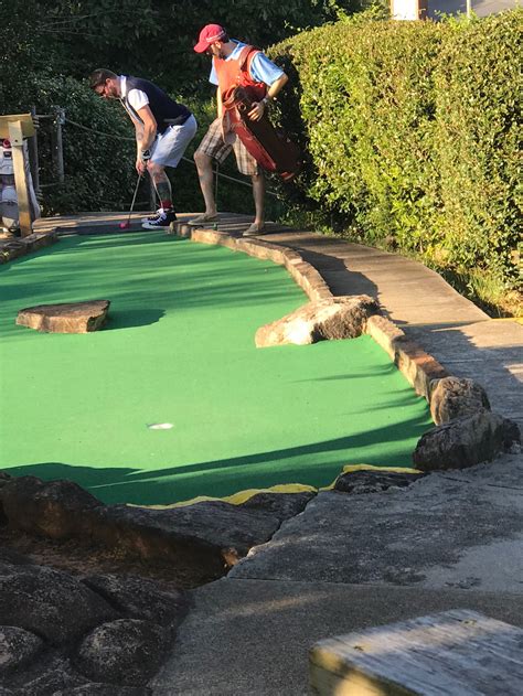 These guys behind us were taking putt putt a bit too seriously : r/funny