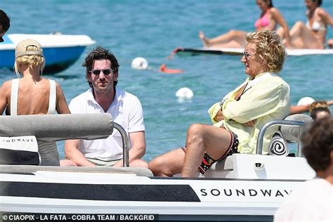 Penny Lancaster Wows In A Tiny Black Bikini As She Soaks Up The Sun With Husband Rod