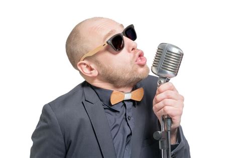 Premium Photo Unshaven Bald Man In A Gray Suit And Sunglasses Holding