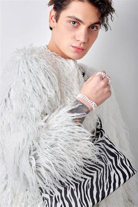 Slim Shirtless Brunette Male Model With Necklace Posing At Camera Isolated On White Stock Photo