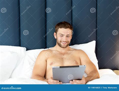 Shirtless Hunky Man With Beard Lies Naked In Bed Stock Image CartoonDealer