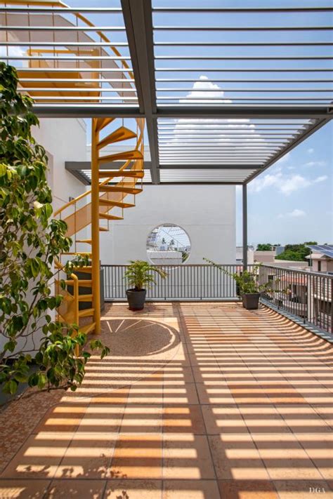 The Sun Shines On An Outdoor Patio With Stairs And Potted Plants In Pots